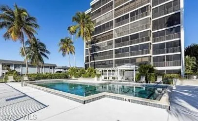 Community pool with a patio