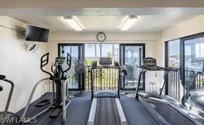 Exercise room featuring a textured ceiling