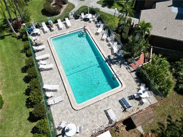 Community pool with a patio