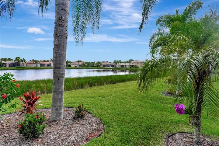 View of yard with a water view