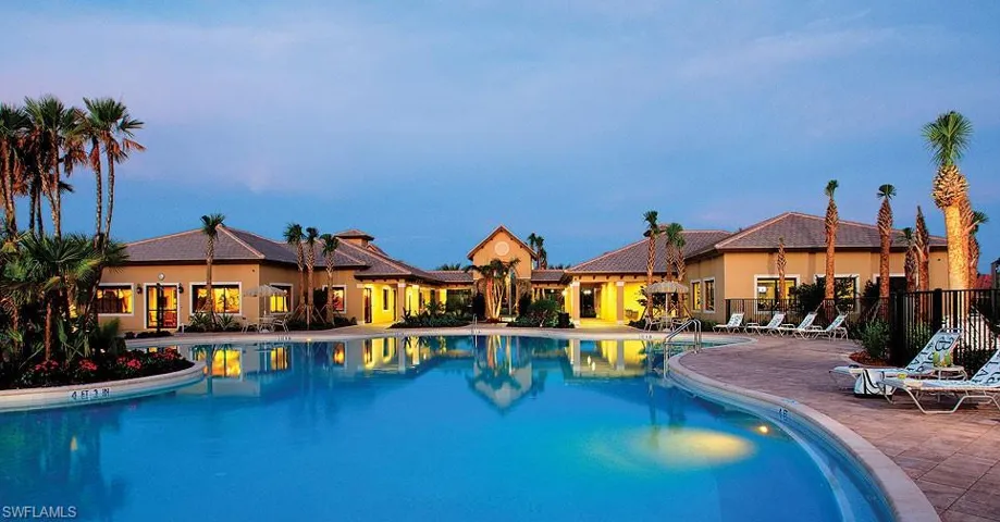 Pool at dusk with a patio area