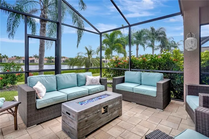 Sunroom / solarium with a water view and plenty of natural light