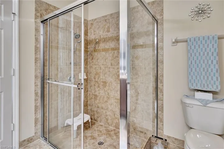Bathroom with walk in shower and toilet