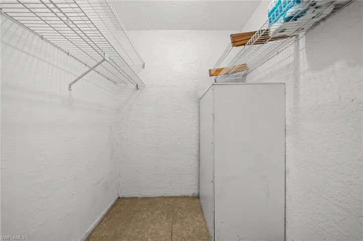 Walk in closet featuring tile patterned floors