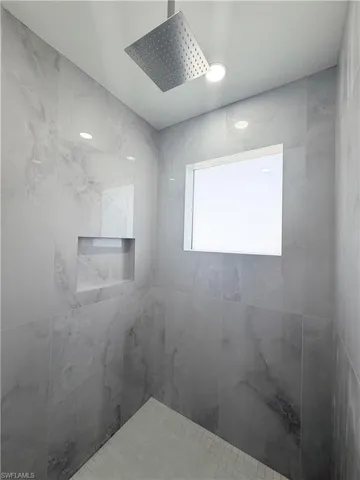 Full bath with tiled shower