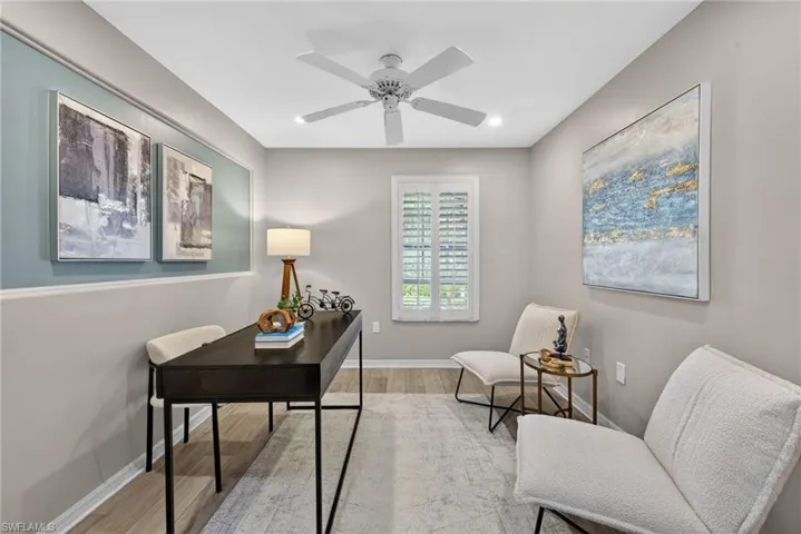 Home office featuring wood finished floors and ceiling fan