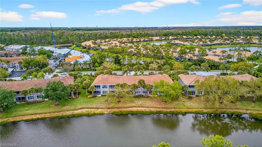 Aerial view of residential area featuring a large body of water