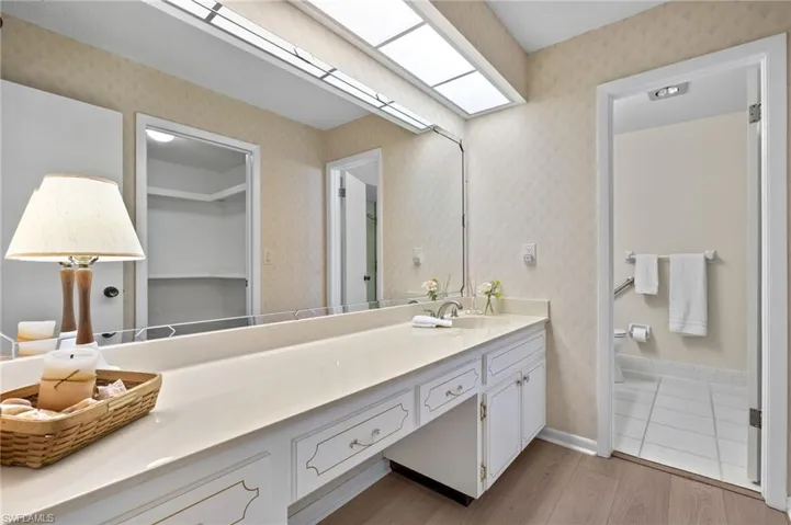 Bathroom with tile flooring and large vanity