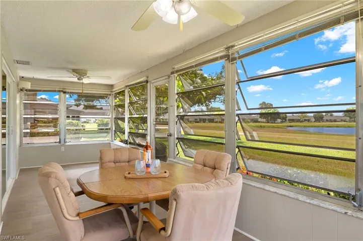 Sunroom featuring ceiling fan