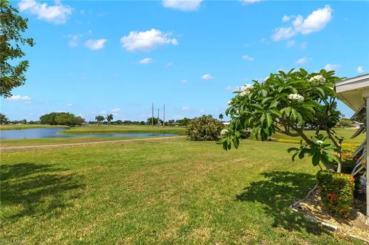 View of yard with a water view