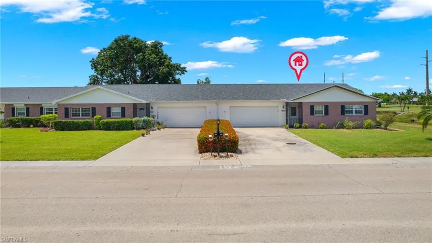 Single story home featuring a front lawn and a garage