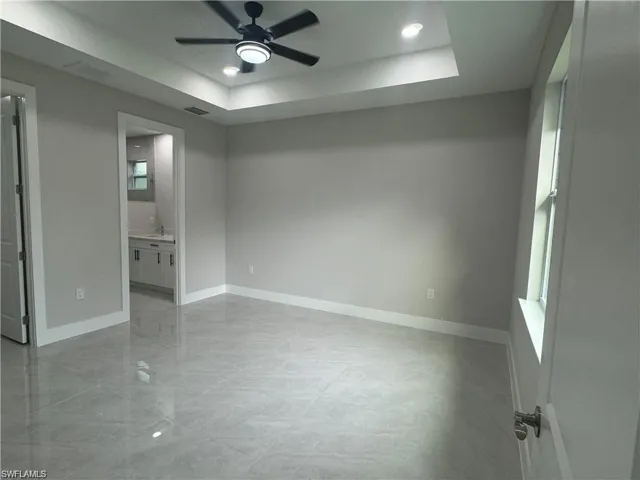 Kitchen featuring french doors, stainless steel appliances, decorative light fixtures, light tile floors, and white cabinetry