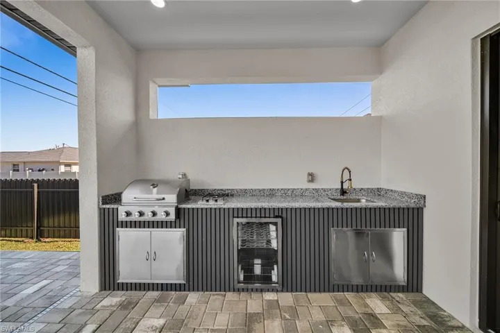 View of patio featuring grilling area and sink