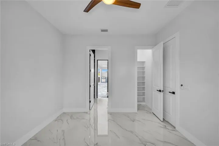 Unfurnished room with ceiling fan