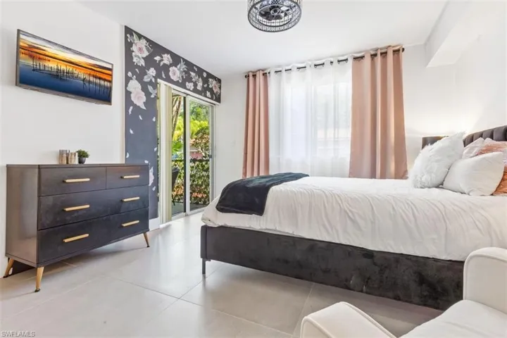Tiled bedroom with access to outside