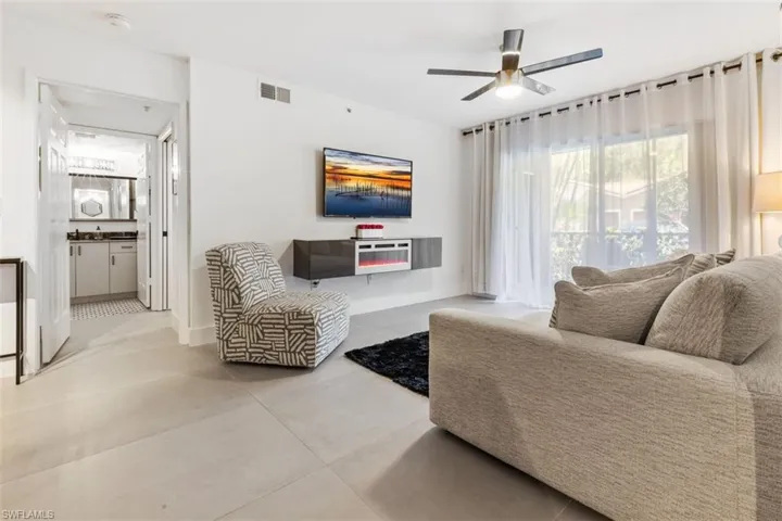 Tiled living room with ceiling fan