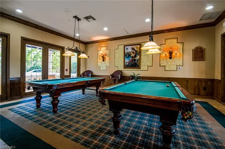 Rec room with billiards, ornamental molding, and carpet floors