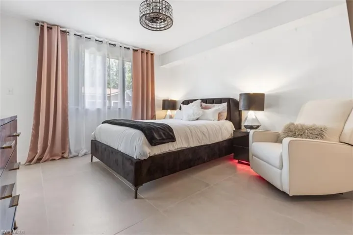 Bedroom featuring tile floors
