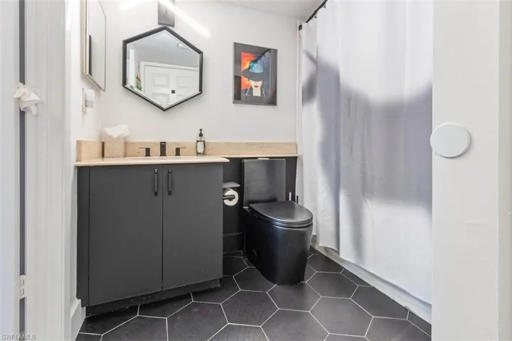 Bathroom with vanity and toilet