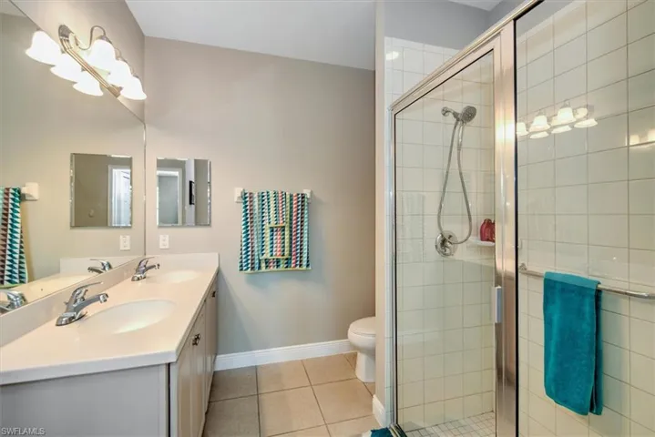 Master bathroom with dual sinks and glass enclosed showere!