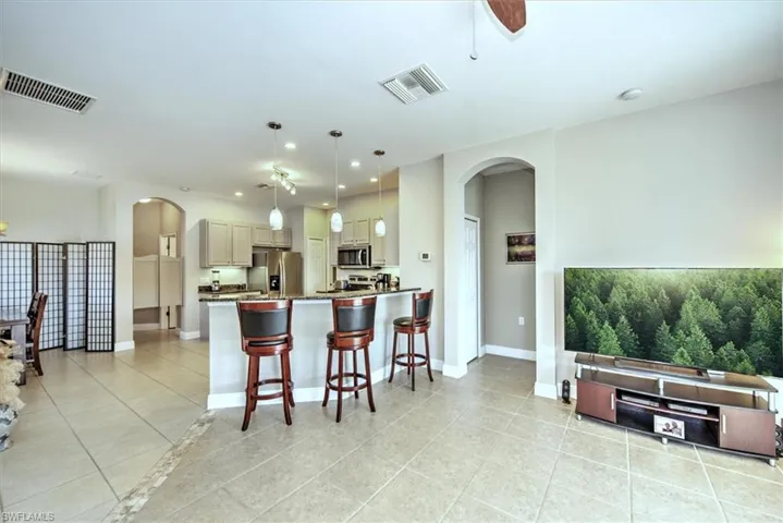 Another view of living room overlooks kitchen breakfast bar area!