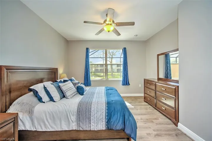 Master bedroom with lighted ceiling fan!