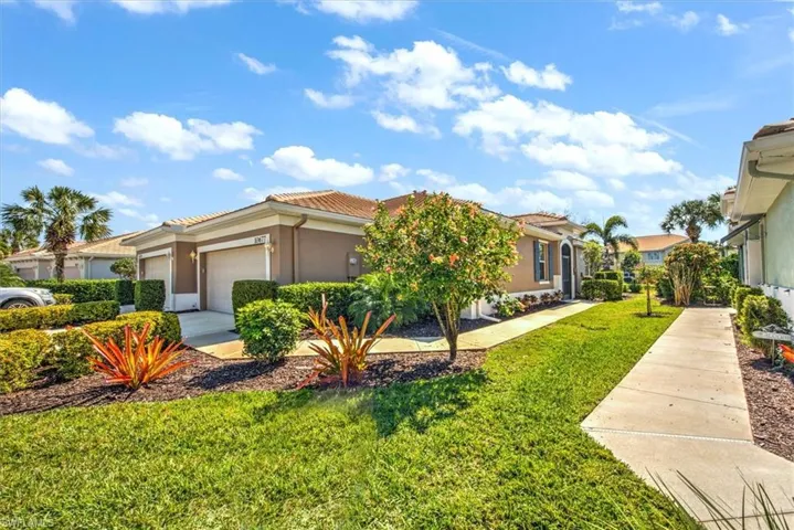 Gracious side entry access with sugar sand walkway!