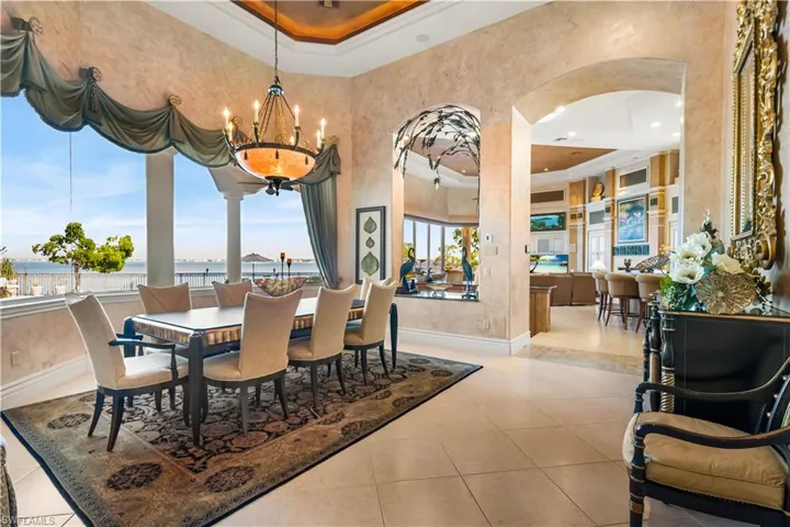 The Formal dining space has marvelous views of the Caloosahatchee River.