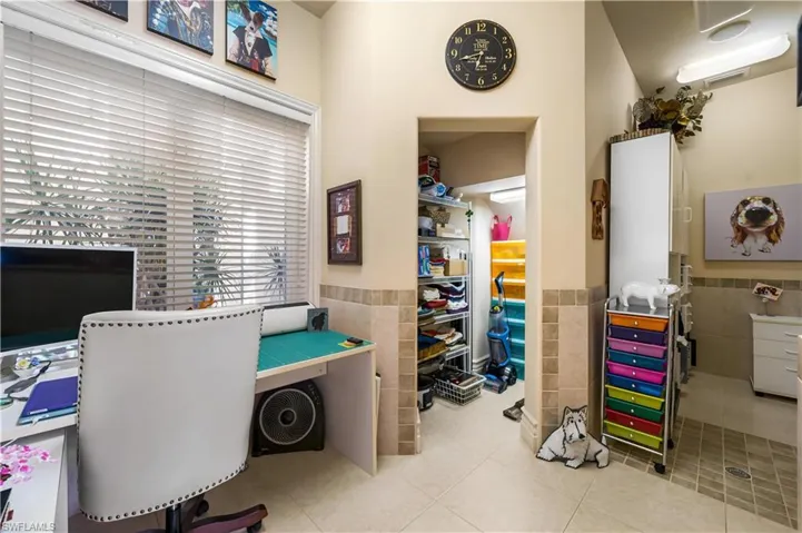 This is an awesome room! The seller has this set up as a small workspace, storage area and there is a drain in the floor on the right. There is a sink in this room on the right side.