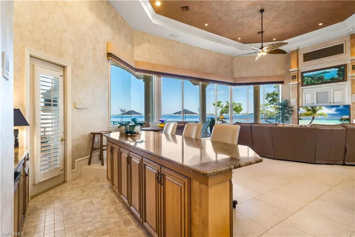 We bar area off of the main living area. Access to the pool from here.  This home was built for entertaining!