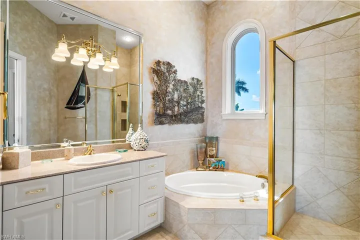 This 2nd ensuite bath has a walk in shower as well as a soaking zen tub.