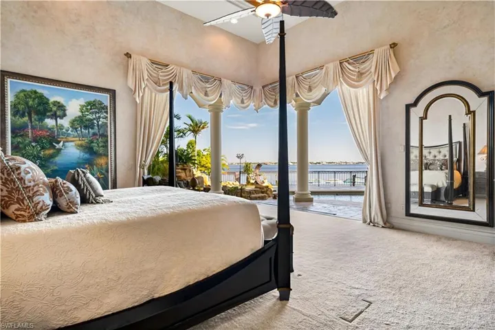 Master wing is located on the first floor. Zero sliders open to your pool area and views of the Caloosahatchee River.