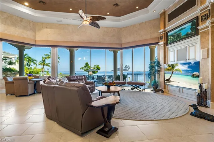 This is your main living area that opens up from your kitchen area.  Offering 16 ft. sliders that open onto your private pool area.