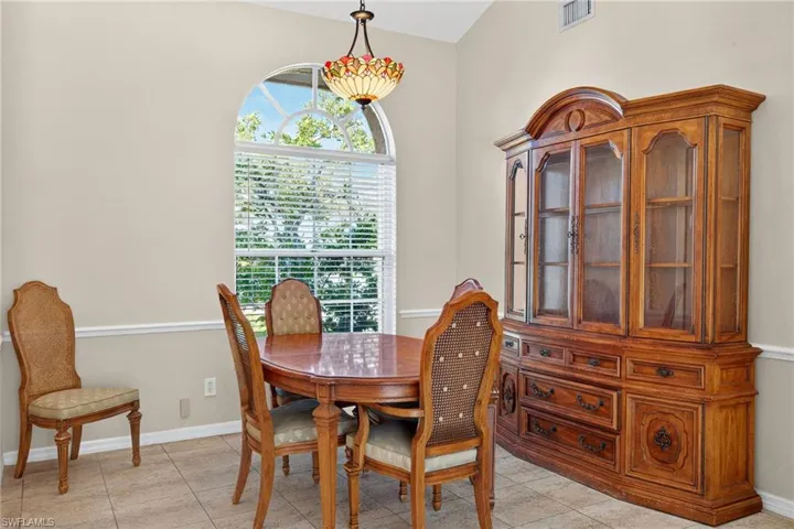 Dining room featuring baseboards and light tile patterned flooring