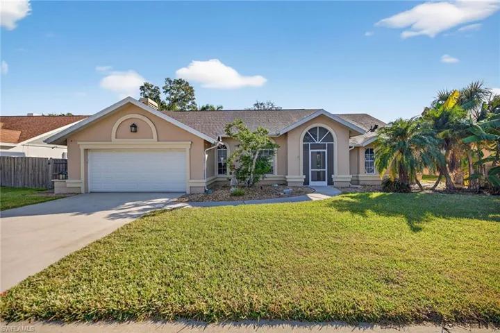 Ranch-style house with stucco siding, concrete driveway, roof with shingles, and an attached garage