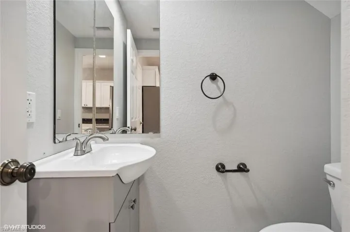 Bathroom with toilet and large vanity