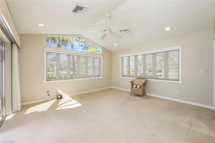 Spare room with vaulted ceiling, a ceiling fan, carpet floors, and recessed lighting