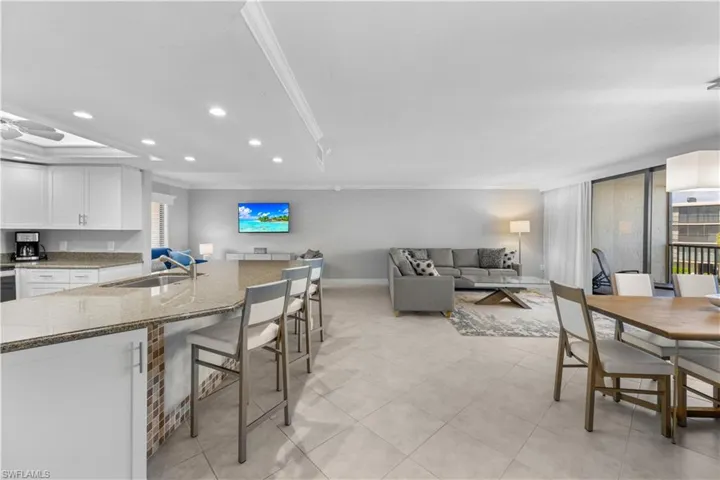 Living, dining, kitchen bar area.
