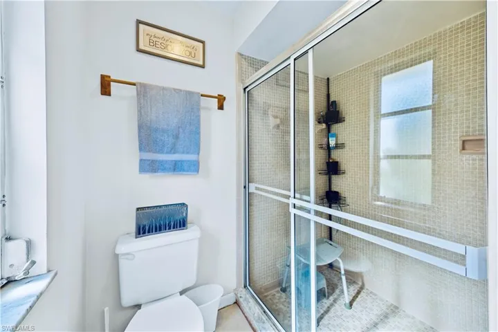 Bathroom featuring toilet and walk in shower