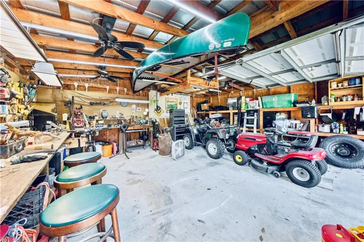 Garage featuring a workshop area and ceiling fan