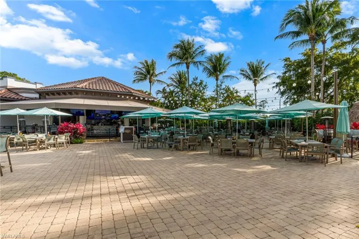 Surrounding community with outdoor dining area and a patio area
