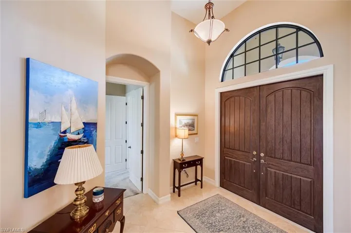 Foyer with a high ceiling and arched walkways