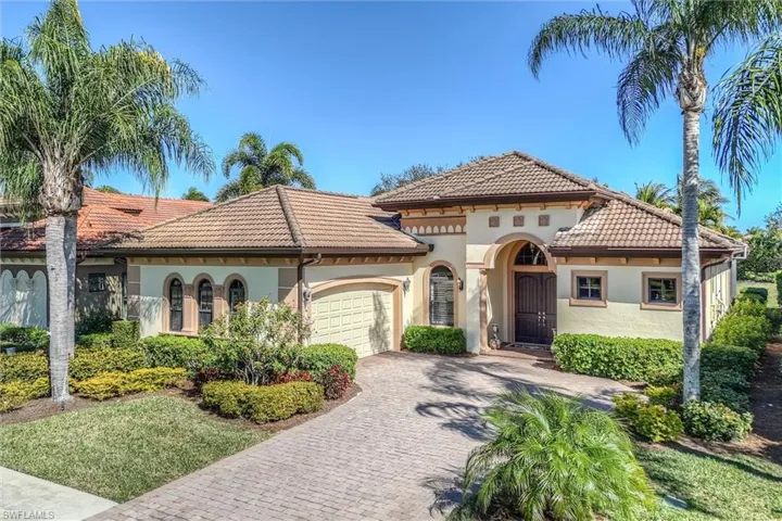 Mediterranean / spanish-style home with stucco siding, decorative driveway, and a tiled roof