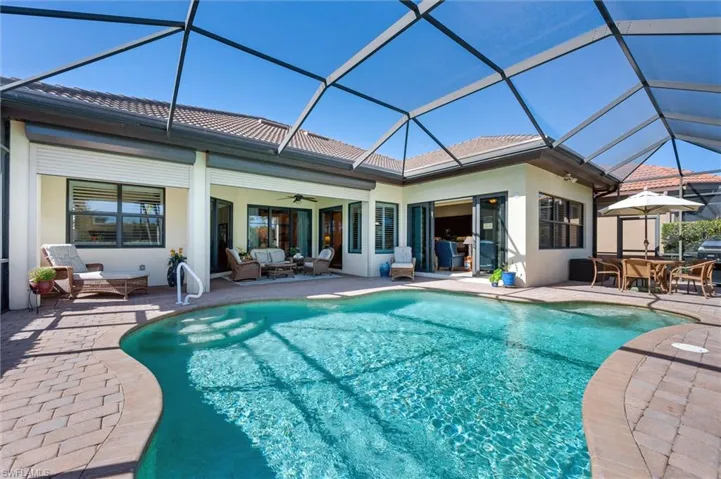 Back of house with a sunroom, a ceiling fan, an outdoor living / dining area, a patio, and stucco siding