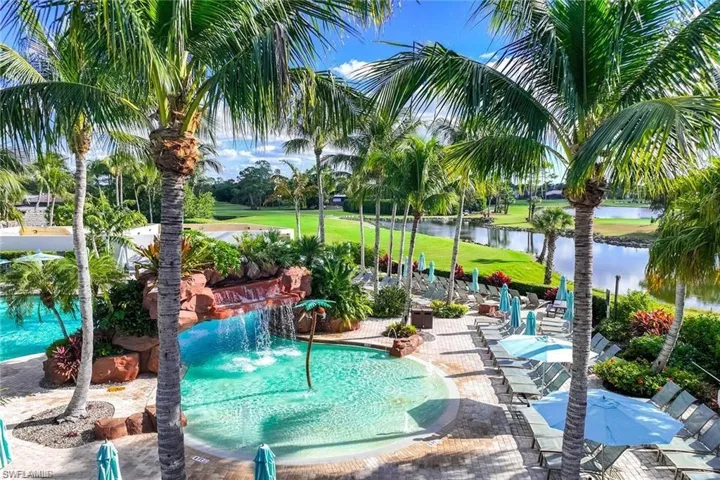 View of community featuring a patio, a pool, and a water view