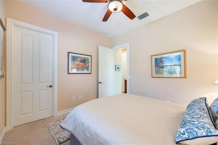 Bedroom with carpet flooring and ceiling fan