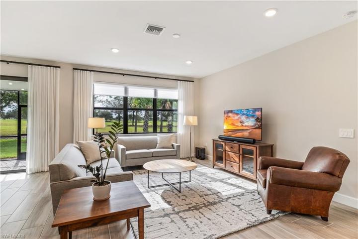 Living Room with Gorgeous Golf Course Views! Impact Resistant Windows/Doors!