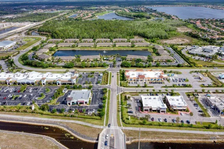Aerial view of property's location with a nearby body of water