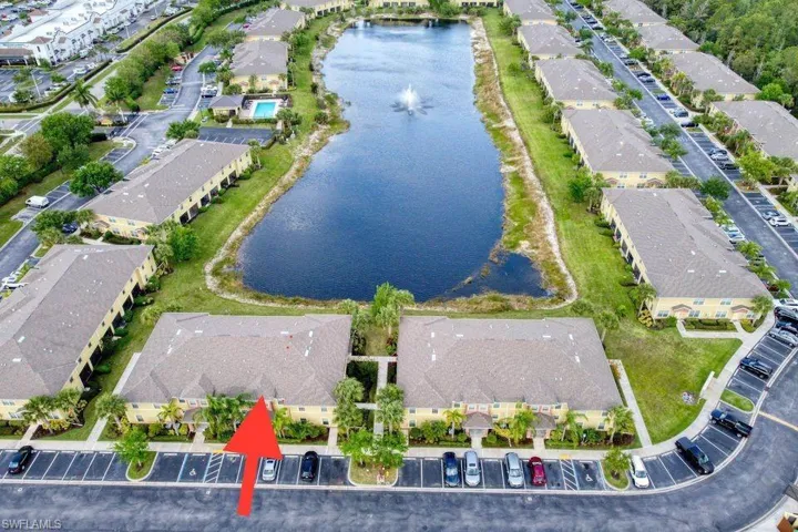 Aerial overview of property's location with a large body of water and nearby suburban area