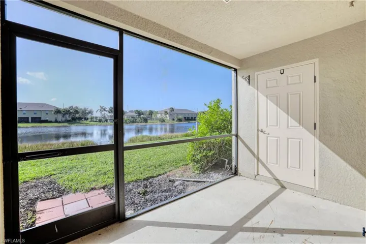 Unfurnished sunroom with a water view